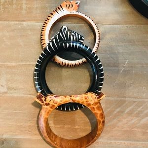 Three wooden animal bracelets